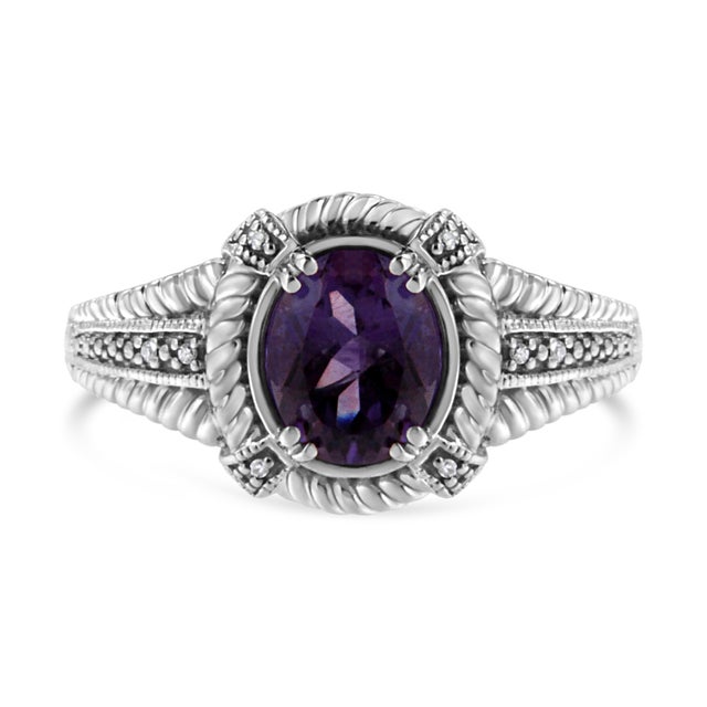 This exquisite amethyst and diamond ring will stun your beloved. Fashioned in radiant sterling silver this dazzling ring...