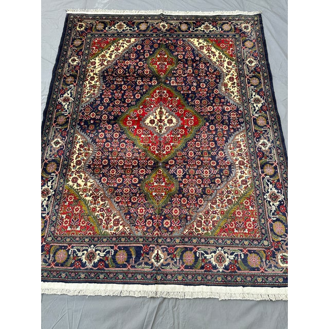 Elevate your interior design with the sophisticated elegance and master craftsmanship of this hand-knotted Tabriz style...