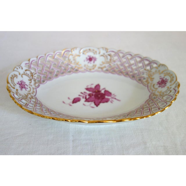 Openwork porcelain bowl, Herend manufacture, Hungary, 20th century. Oval, flared shape with an openwork braided rim,...