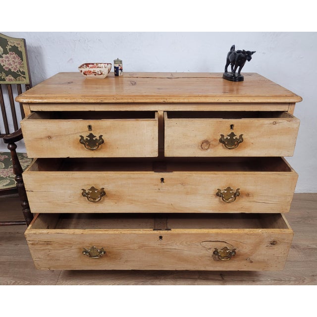 This is a gorgeous pine chest of drawers, with exquisite and timeless Victorian qualities. Circa 1890. Displaying an...