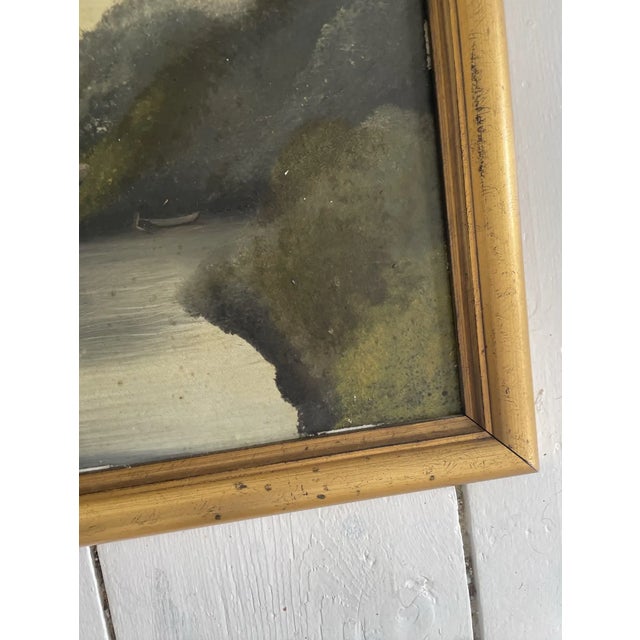 A stunning antique oil painting on panel depicting a country riverside home. This painting could be Dutch or German, but...