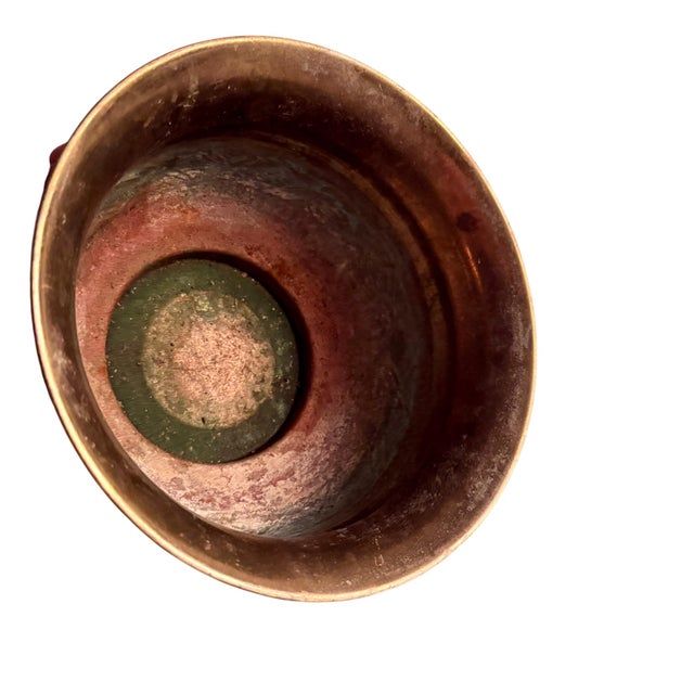 Brass wastebasket with raised and pressed detailing all around the exterior. Heavy copper undertones. Shows lots of...