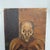 A striking vintage oil on canvas panel depicting a gaunt, huddled male figure rendered in a powerful Expressionist style....