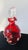 This striking mid-century art glass decanter features rich ruby-red hand-blown glass accented with applied clear glass...
