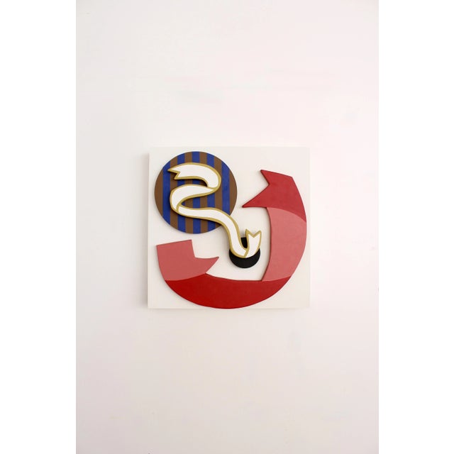 Three dimensional wood painting featuring an eclectic, celebratory design. Featuring ribbon-like shapes layered upon a...