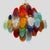 A unique chandelier composed of multicoloured Vistosi glass discs in blue, orange, red, yellow, white, green, Campari,...