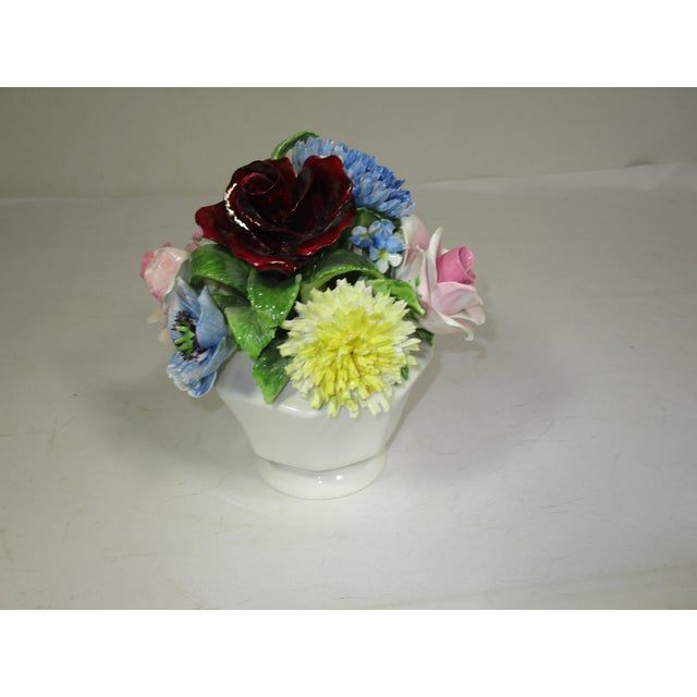 A large bone china floral bouquet on a white compote, made by the Radnor Co. in Staffordshire England. This hand-made...