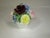 A large bone china floral bouquet on a white compote, made by the Radnor Co. in Staffordshire England. This hand-made...