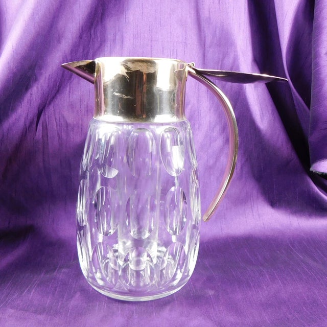 This is a very large and heavy cut crystal wine decanter with an ice insert. It does not have any markings on the crystal...