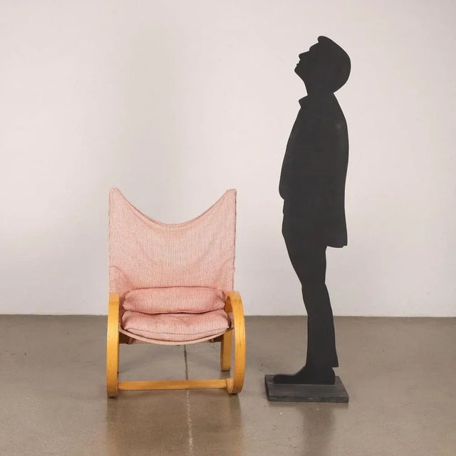 Armchair with curved wooden structure with armrests, seat in original red and white striped fabric with cushion. This...