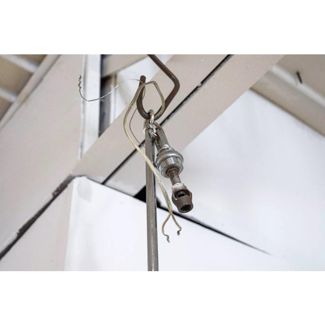 A chrome and lucite waterfall chandelier. This is a stunning light fixture with contemporary styling and materials. This...