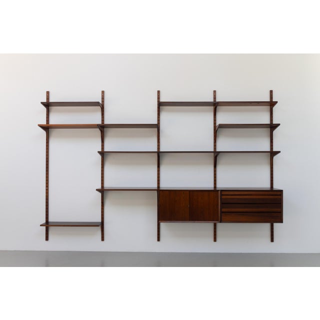 Vintage Danish Rosewood Modular Wall Unit by Poul Cadovius for Cado, 1960s. Scandinavian Mid-Century Modern 4 bay shelving...