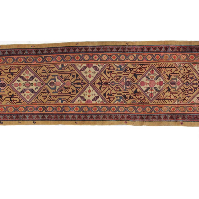 This masterpiece is a wool on wool pile genuine hand woven antique Persian Bakhshaish runner in excellent condition. The...