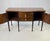Crafted by elite furniture maker Theodore Alexander, this serpentine sideboard is an official reproduction from the...