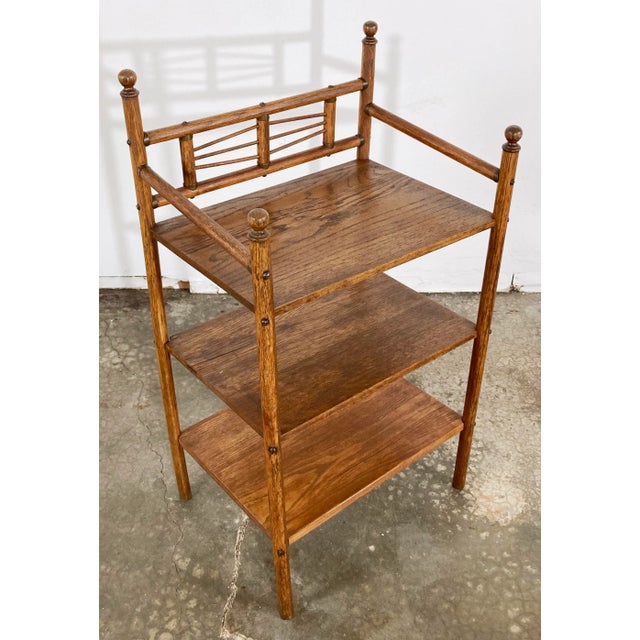 Vintage three (3) tier wood shelf. Features rounded carved wood finials atop each support. Very versatile in design and...