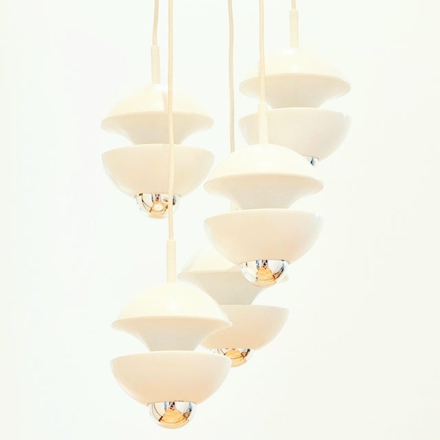 Stunning space age cascading pendant designed by klaus hempel for kaiser leuchten (germany, 1970s). This model won one of...