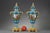 Pair of covered polychrome porcelain vases in the style of Sèvres with gilt bronze mounts. The base stands on four claw...