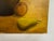 A Belgian mid-century still life painting, likely dating to the 1960s, rendered in a warm, subdued palette. The...