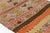 This is a vintage Turkish Oushak rug from the Mid 20th Century. The piece was hand-knotted.