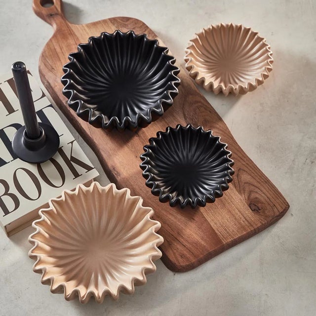 The beautifully crafted decorative, Lehriya Porcelain Bowls are designed to be a striking accent for any space. Its...