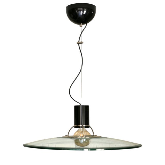 Large Chandelier in Thick Glass, Chrome and Black Lacquered Metal, Italy, 1970s, in Flawless conditions. Designed 1970 to...
