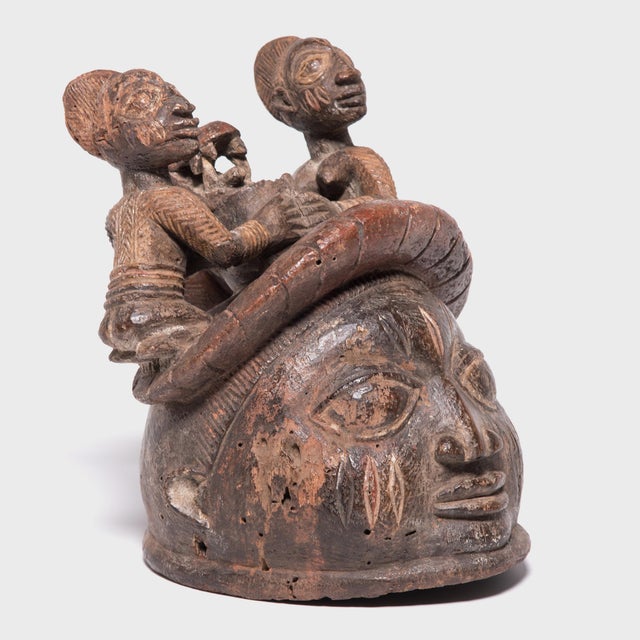 This helmet mask was created by the Yoruba peoples of western Nigeria, and was worn during a tradition known as Gelede. A...