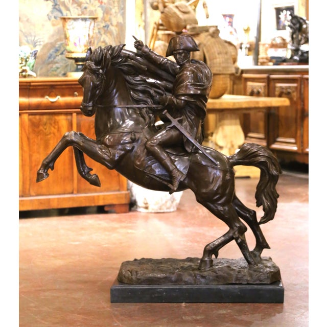 Make a commanding statement with this exceptional antique bronze sculpture depicting Napoleon Bonaparte on horseback....