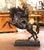 Make a commanding statement with this exceptional antique bronze sculpture depicting Napoleon Bonaparte on horseback....