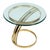 A sleek Milo Baughman style side table featuring a sculptural polished brass base and round glass top. The thick, beveled...