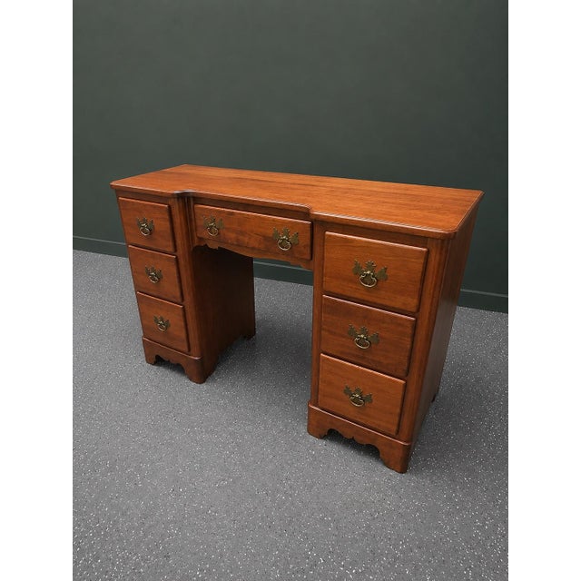 A beautifully crafted mid-20th-century mahogany writing desk by The Continental Furniture Company of High Point, North...