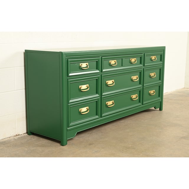 A fine mid-century modern Hollywood Regency Campaign nine-drawer dresser or credenza By Thomasville, "Huntley" Collection...