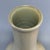 Fine antique Chinese celadon long‑neck vase. Elegant slender neck paired with bulbous lower body, covered in soft crackled...