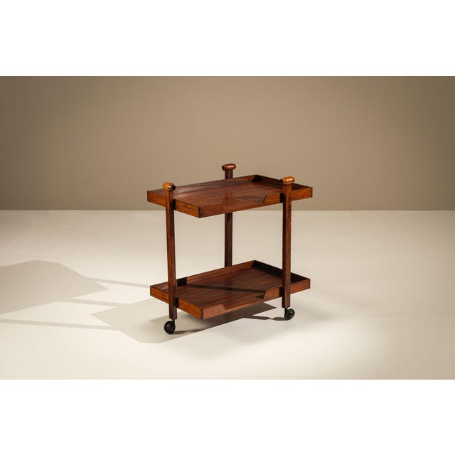 Some objects express their quality through quiet confidence. This elegant serving trolley, designed by franco albini and...