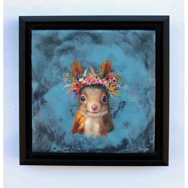 This mixed media piece features a whimsical squirrel adorned with a vibrant floral crown, set against a serene blue...