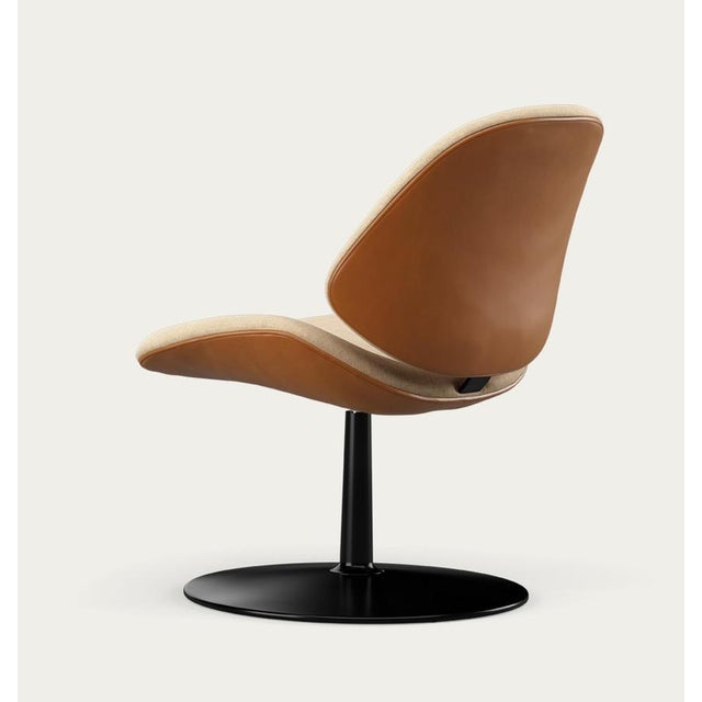 Salto and sigsgaard council family lounge chair legs: black, duo upholstery: front: remix 242 + back: nevada cognac for...