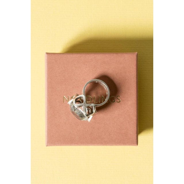 Cool silver and rock crystal ring by Karl-Ingemar Johansson, with an oversized stone and decorative diamond shaped frame...
