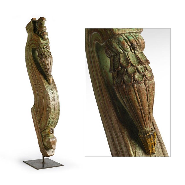 Sculpture in antique teak on metal base. This piece is designed in the style of the selected designer and/or manufacturer