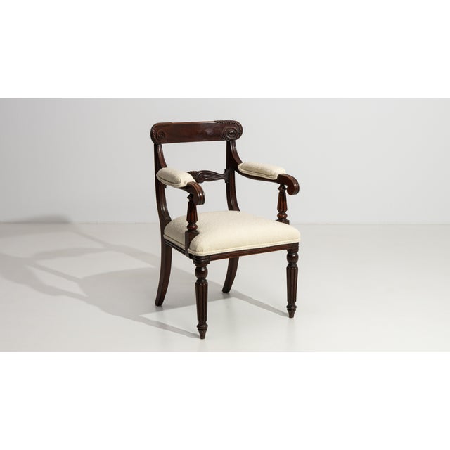 A distinguished example of William IV craftsmanship, this stately carver armchair embodies the bold, masculine aesthetic...