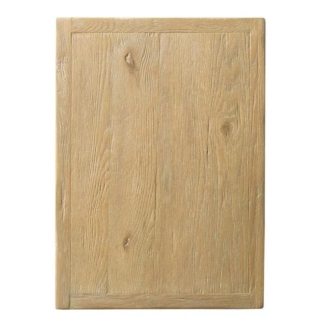 A sophisticated table with clean styling that has a rectangular framed top resting over two shelves elevated by squared...