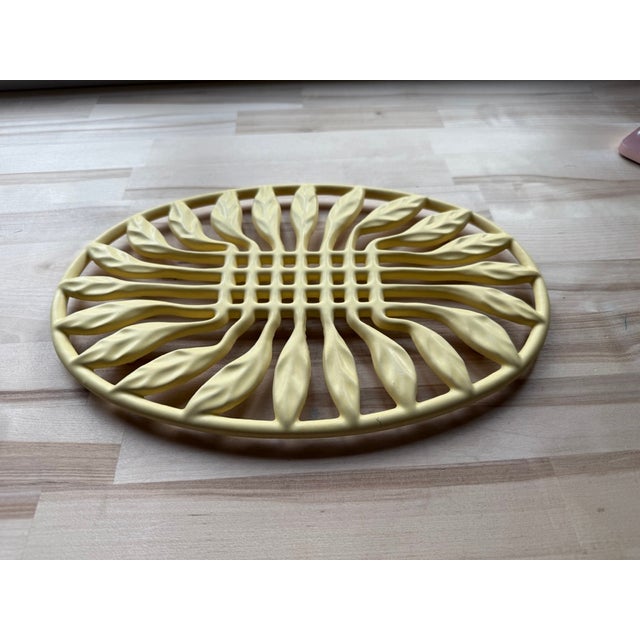 Vintage Yellow Invicta Enameled Cast Iron Trivet, Made in France. The enamel has dulled over the years, but in excellent...