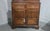 A very nice two piece Georgian oak court cupboard with panelled sides and doors, two drawers and four doors, standing on...
