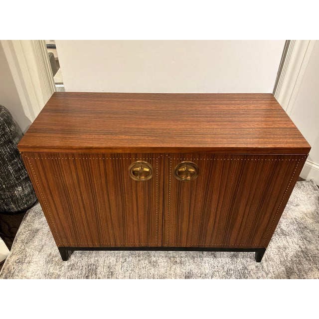 Stylish Baker Laura Kirar Arca Chest. Brown mahogany wood, gold hardware. Black legs. 3 shelves. Original Retail $7197....