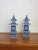 A pair of blue and white ceramic pagodas, cleverly fashioned as jars with removable lids. A lovely addition to a...