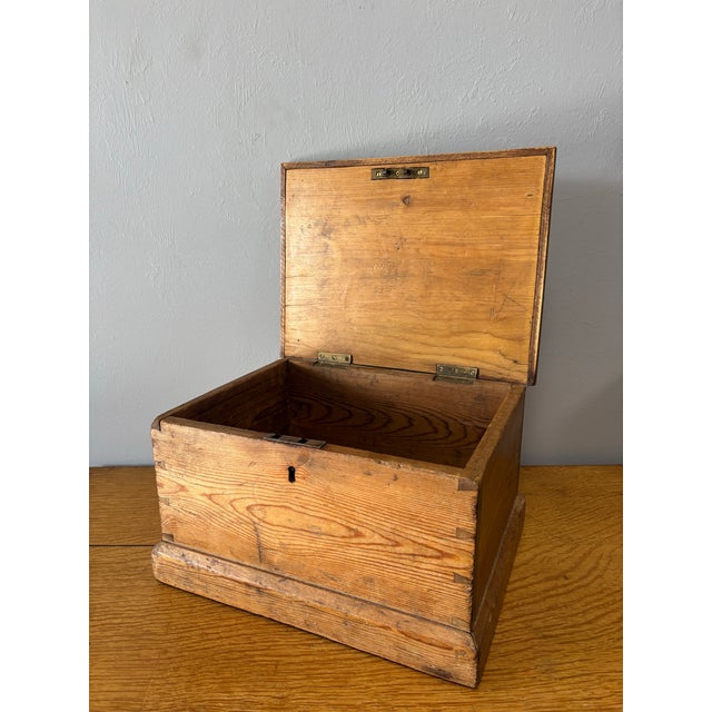 There’s a quiet honesty to this 19th-century English pine box—one that feels earned, not manufactured. Hand-hewn joinery...