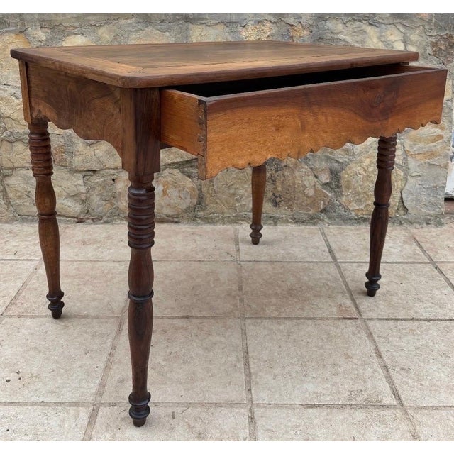 Beautiful late 19th to early 20th century provincial farmhouse table crafted in solid walnut with a warm, naturally aged...