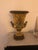 Beautiful porcelain vase with golden bronze base and trim on top rim with an elegant floral pattern in yellow and green....