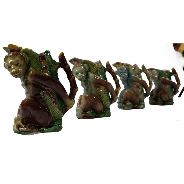 Impressive 19th century majolica monkey vases in graduated sizes ranging from 8" to 10" tall. Depicted in Majolica...