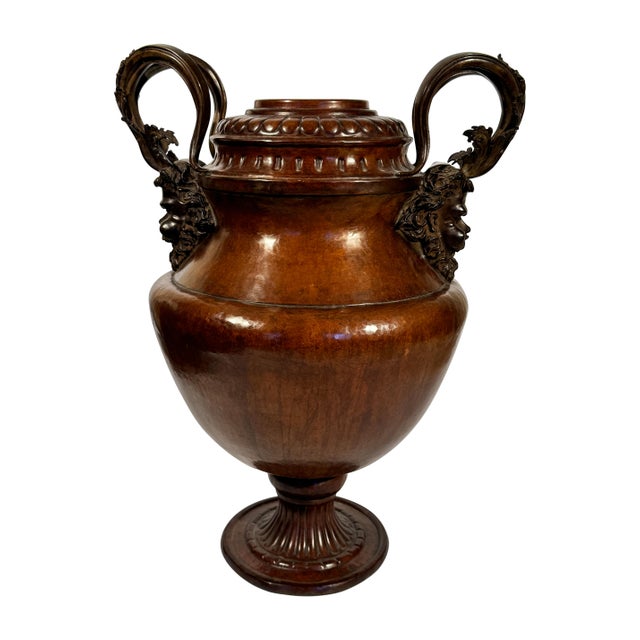 A spectacular and commanding bronze urn, richly embellished with Renaissance-inspired classical detailing. From sculpted...