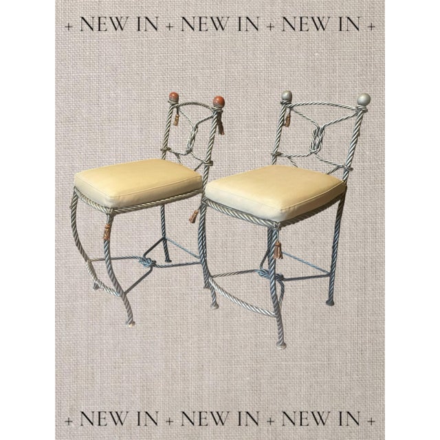 A fabulous pair of rope twist heavy gauge iron bar or counter stools. Overall height 39”. Seat height 26” off floor. Faux...