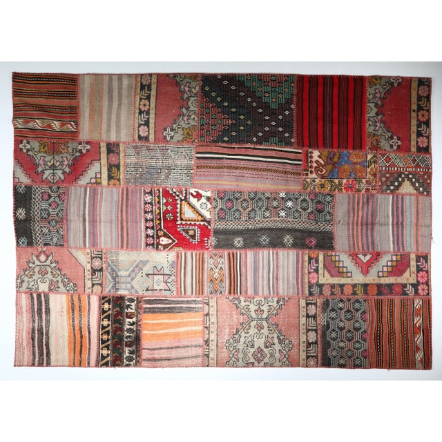 Vintage Anatolian Kilim Patchwork Rug Crafted From Tribal Handwoven Kilims -6' 5'' X 9' 10'' This striking patchwork kilim...